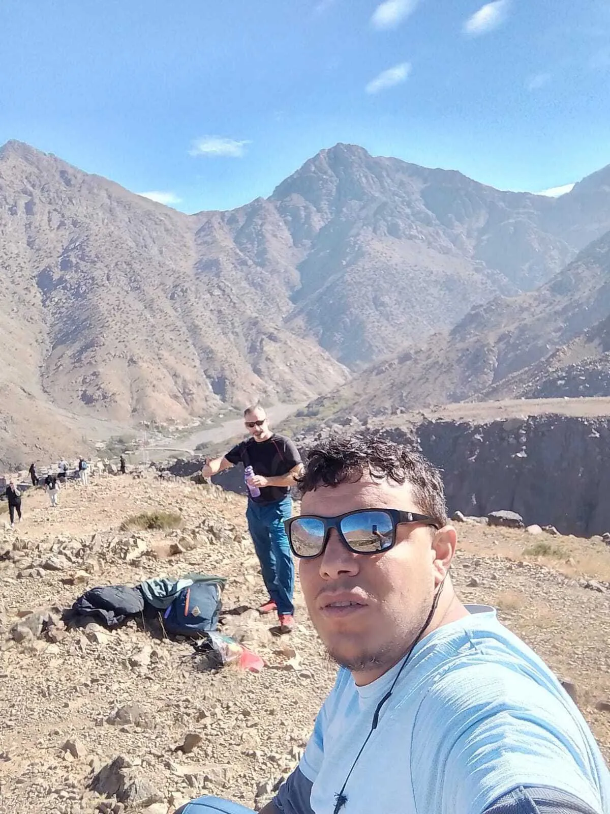 Omar guiding a trekker on the trail towards Mount Toubkal